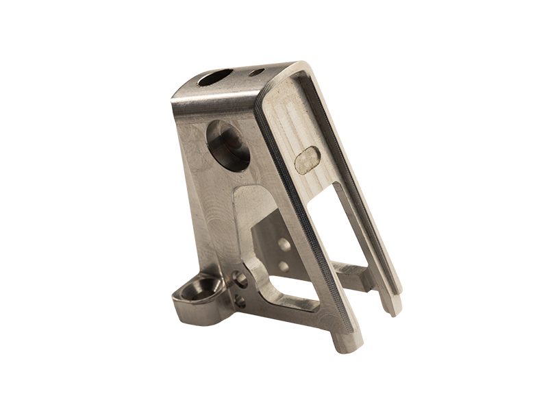 Mustad Belgium — precision machined bracket defence component